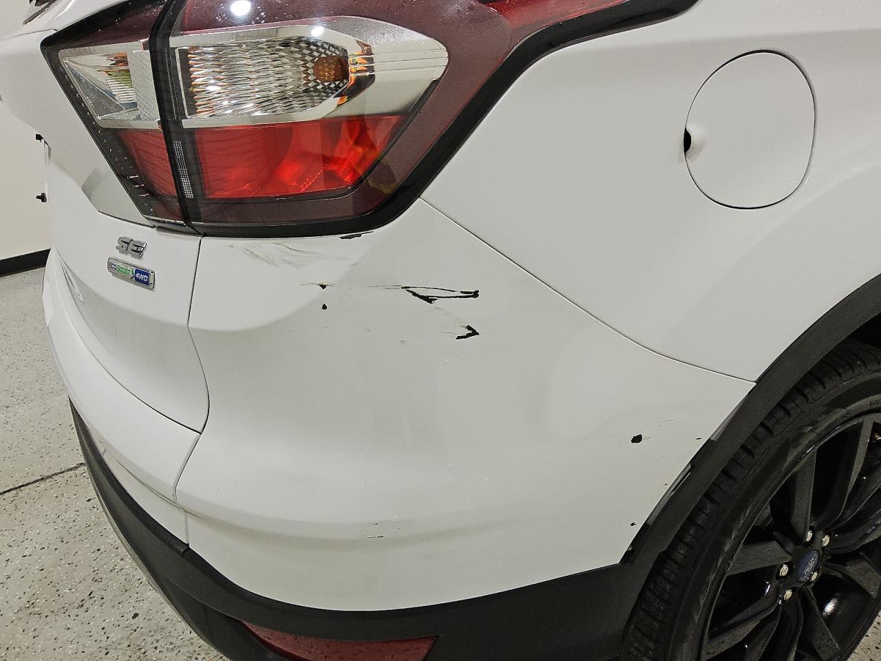2018 Ford Escape Se White vin: 1FMCU9GD2JUD25303 Damage: Rear Bumper, Heavy Scratch, > 12 Inches