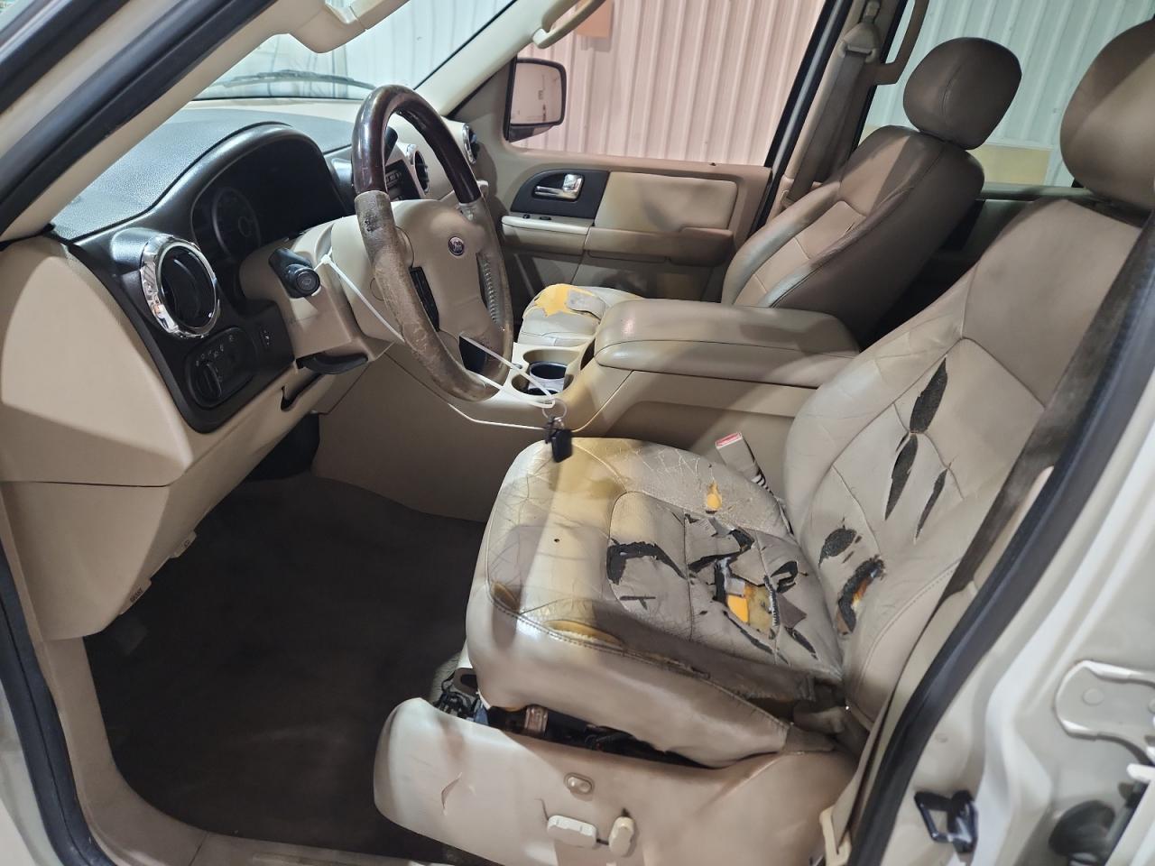 2005 Ford Expedition Limited White vin: 1FMFU20525LA70090 Damage: Left Front Seat, Torn, > 12 Inches