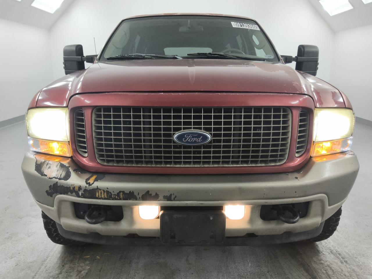 2003 Ford Excursion Eddie Bauer Brown vin: 1FMSU45P93EC17687 Damage: Front Metal Bumper Painted, Peeling, > 12 Inches