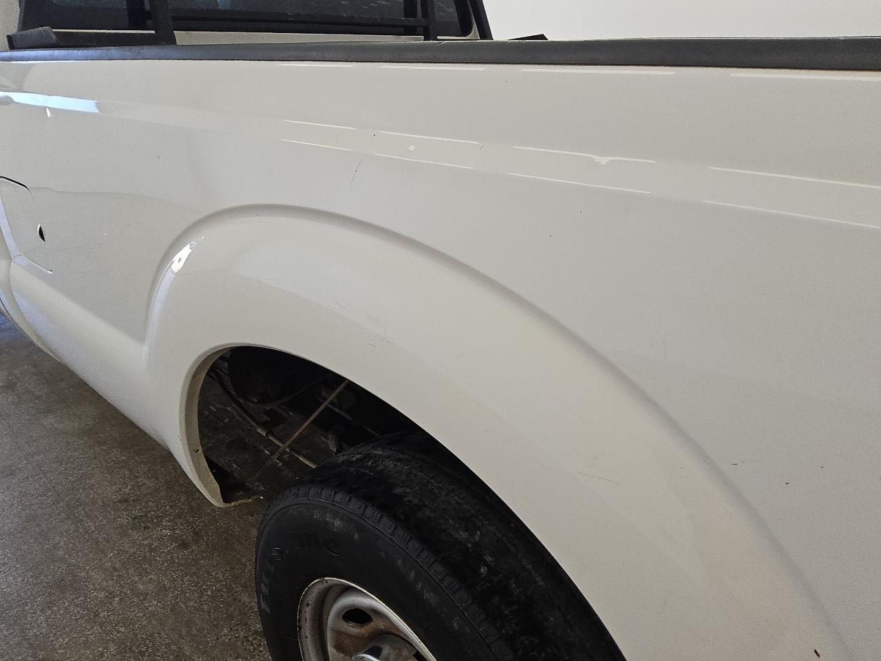 2015 Ford F250 Super Duty White vin: 1FTBF2A62FEA07369 Damage: Left Bed Side, Heavy Scratch, 1 To 2 Inches