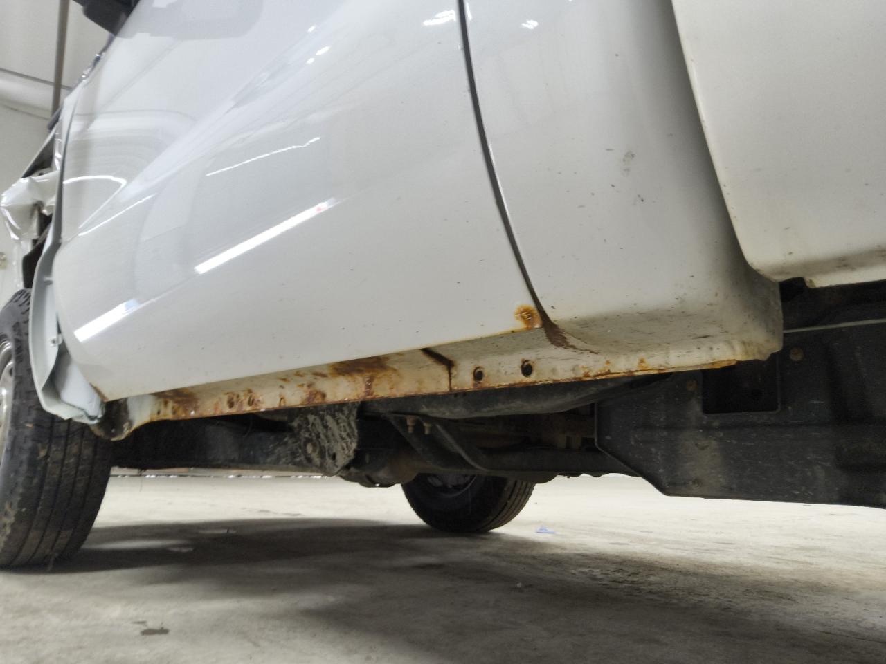 2015 Ford F250 Super Duty White vin: 1FTBF2A6XFEB63790 Damage: Left Rocker Panel, Rust, > 12 Inches