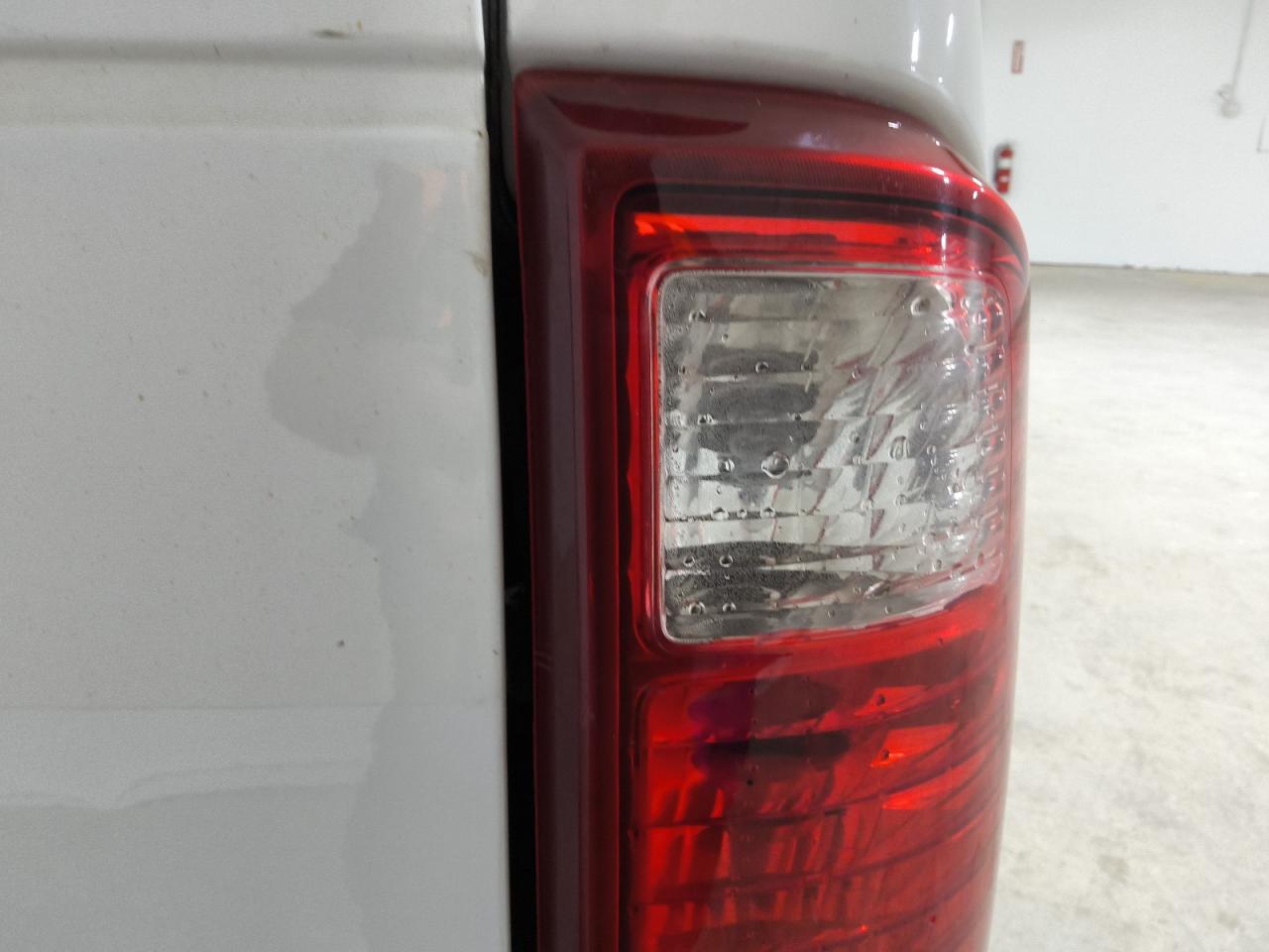 2015 Ford F250 Super Duty White vin: 1FTBF2A6XFEB63790 Damage: Right Tail Light, Water Damage, Replacement Required
