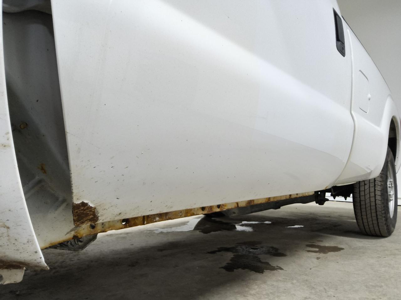 2015 Ford F250 Super Duty White vin: 1FTBF2A6XFEB63790 Damage: Left Front Door, Rust, 5 To 6 Inches
