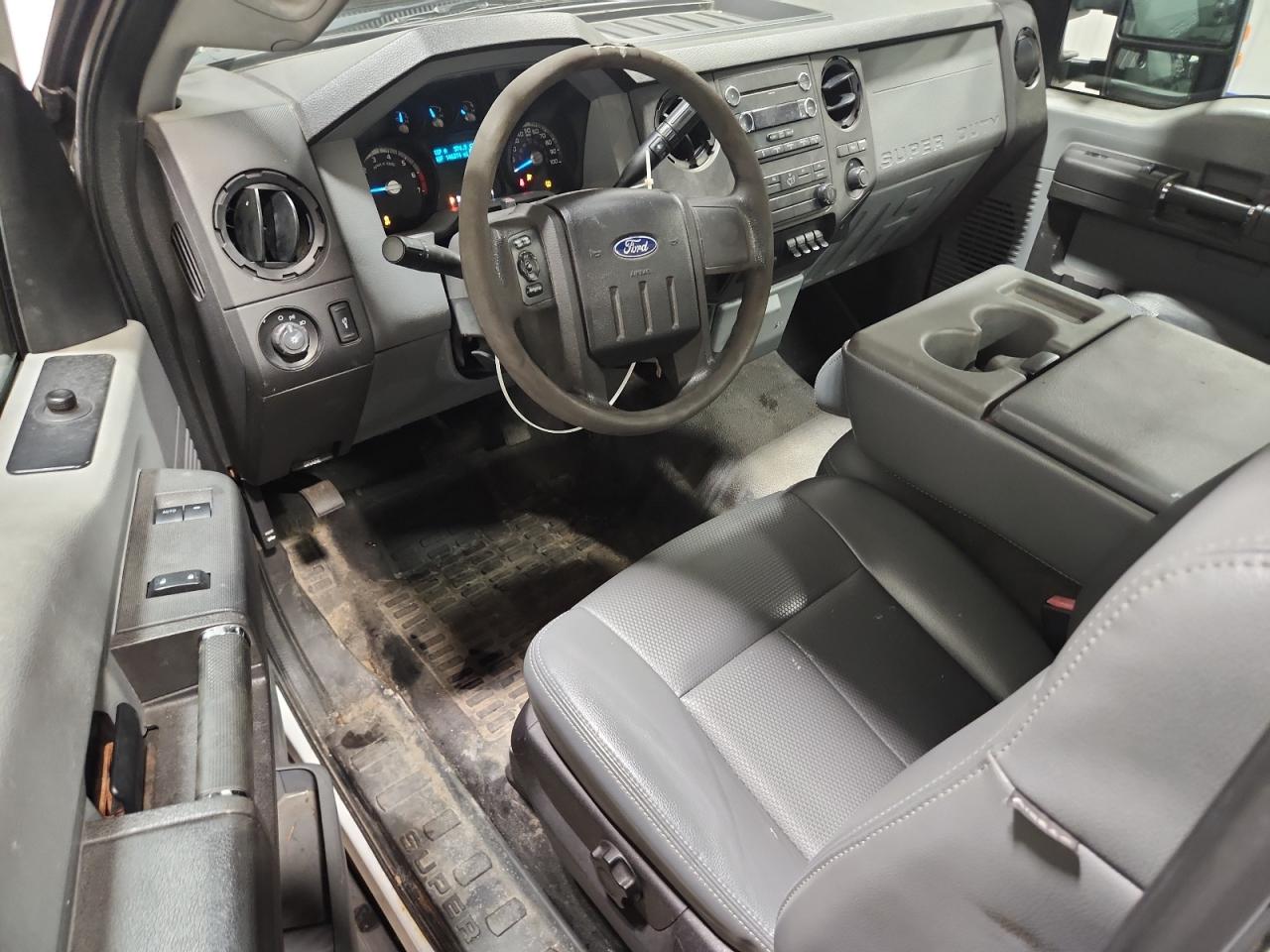 2011 Ford F250 Super Duty White vin: 1FTBF2B68BEA76365 Damage: Left Front Seat Cushion, Torn, 1/2 To 1 Inch