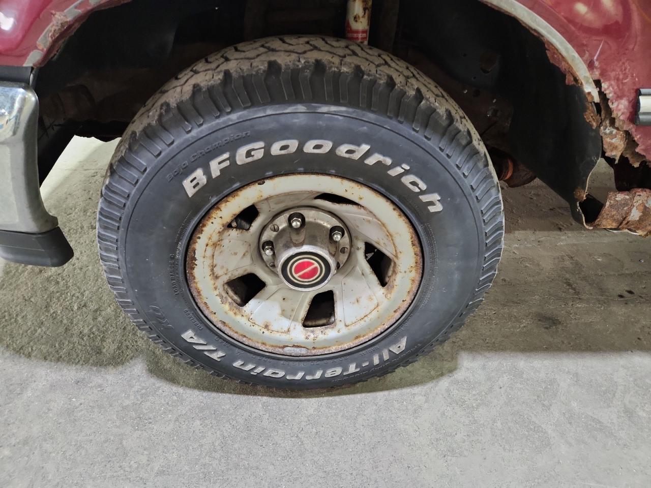 1993 Ford F150 Red vin: 1FTEF15NXPLA62030 Damage: Left Front Wheel, Rust, Repair Required