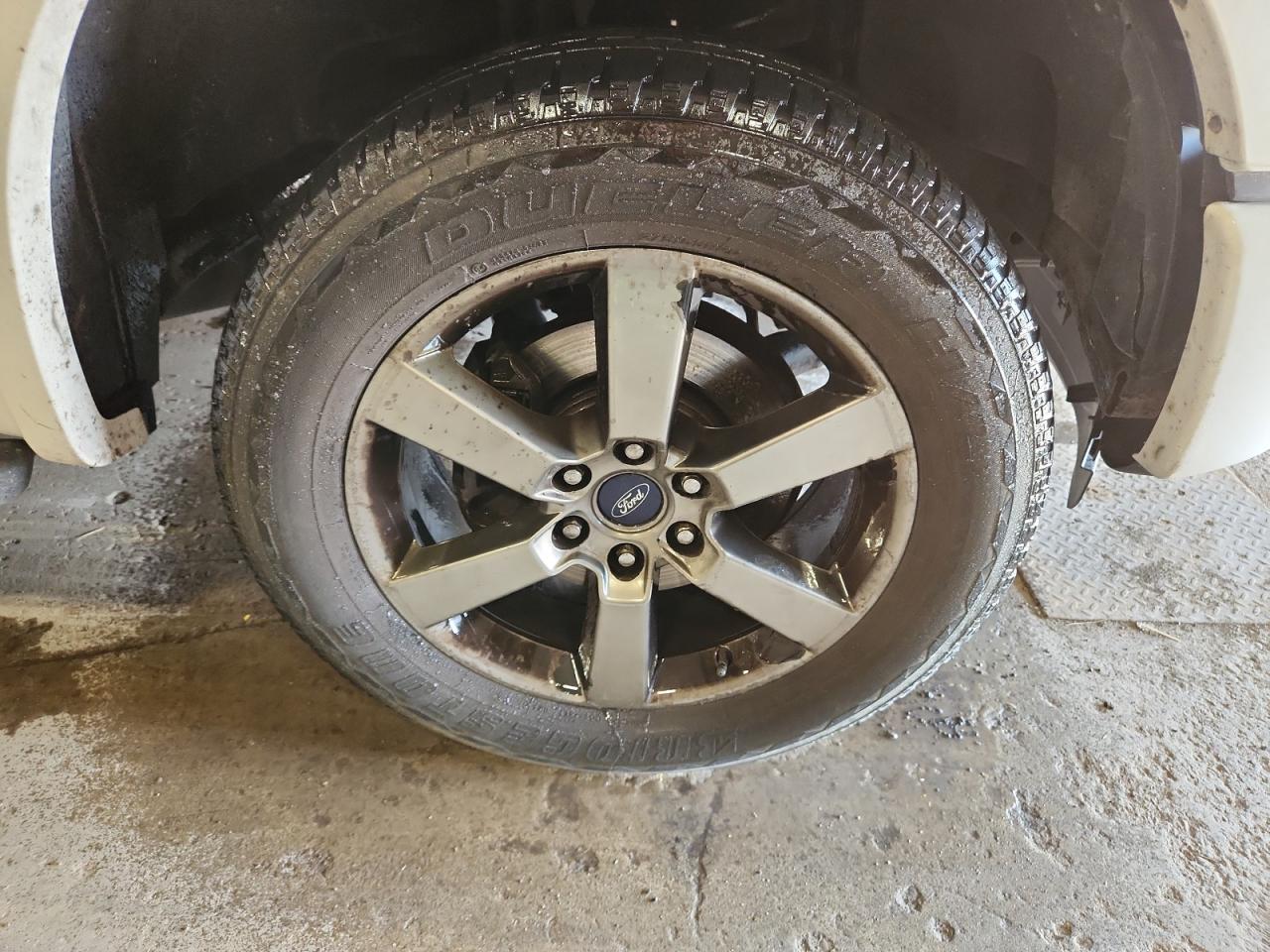 2015 Ford F150 Supercrew White vin: 1FTEW1CF5FFC98500 Damage: Right Front Wheel, Corrosion, > 12 Inches
