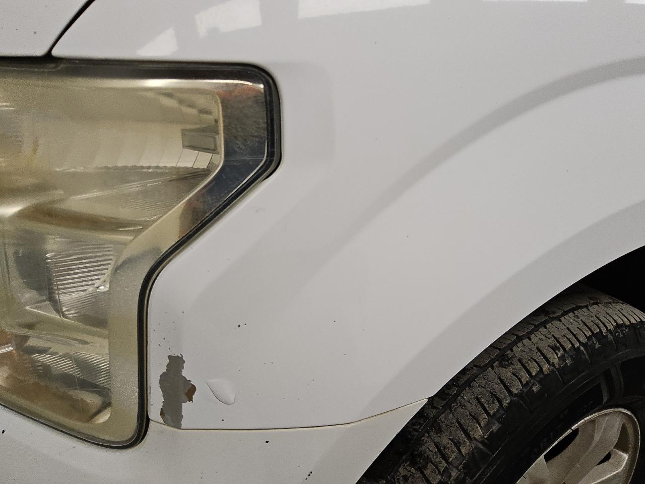 2015 Ford F150 Supercrew White vin: 1FTEW1CP6FKD55707 Damage: Left Front Fender, Peeling, 3 To 4 Inches