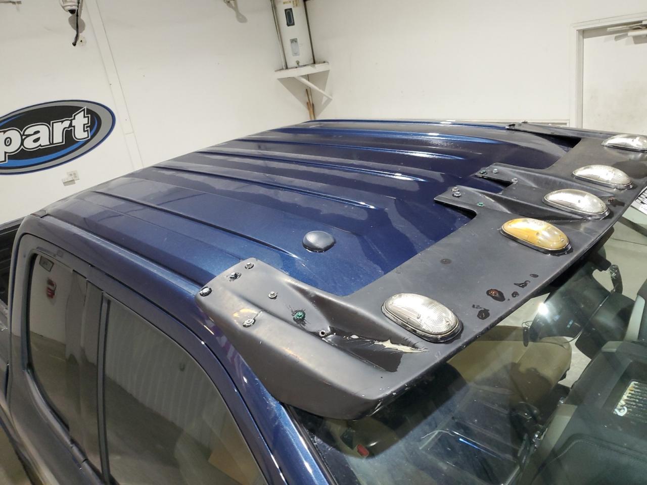 2015 Ford F150 Super Cab Blue vin: 1FTEX1EP4FFA54758 Damage: Roof, Hole(S), 2 To 3 Inches
