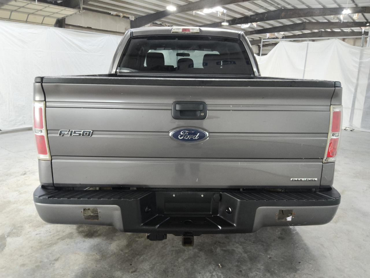 2014 Ford F150 Supercrew Gray vin: 1FTFW1CF4EKD42870 Damage: Rear Metal Bumper Painted, Hole(S), 7 To 8 Inches