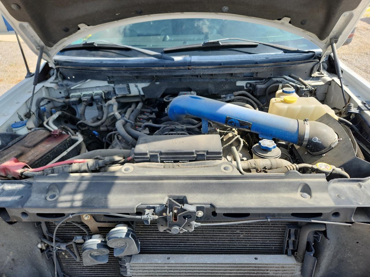 2011 Ford F150 Supercrew White vin: 1FTFW1E67BFA47022 Damage: Air Intake Duct, Aftermarket, Acceptable