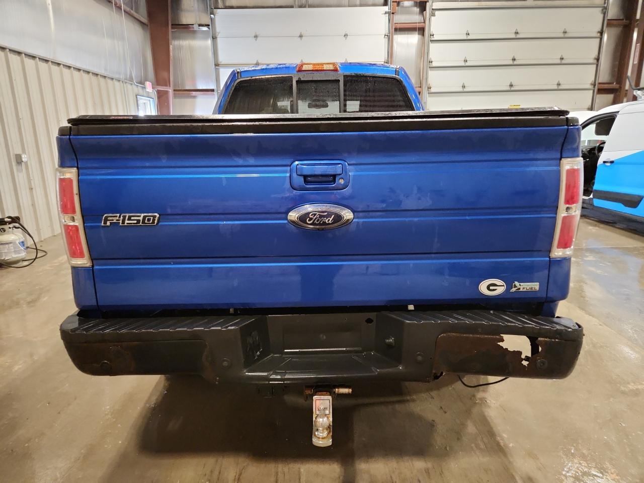 2010 Ford F150 Supercrew Blue vin: 1FTFW1EV9AFB70567 Damage: Rear Metal Bumper Painted, Rust, > 12 Inches