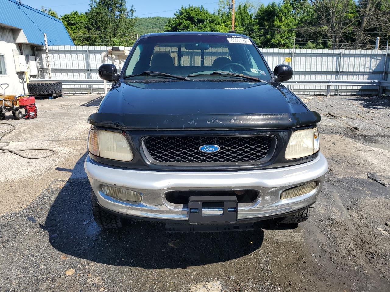 1997 Ford F250 Black vin: 1FTFX28L2VNB56258 Damage: Front Bumper Molding, Chipped, 2