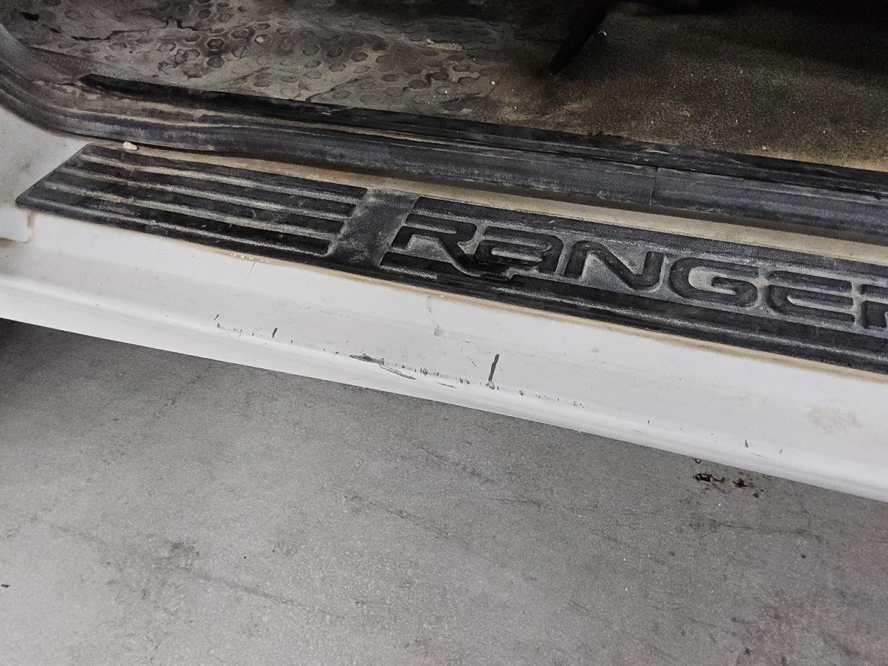 2010 Ford Ranger White vin: 1FTKR1AD0APA21946 Damage: Left Rocker Panel, Heavy Scratch, 1 To 2 Inches