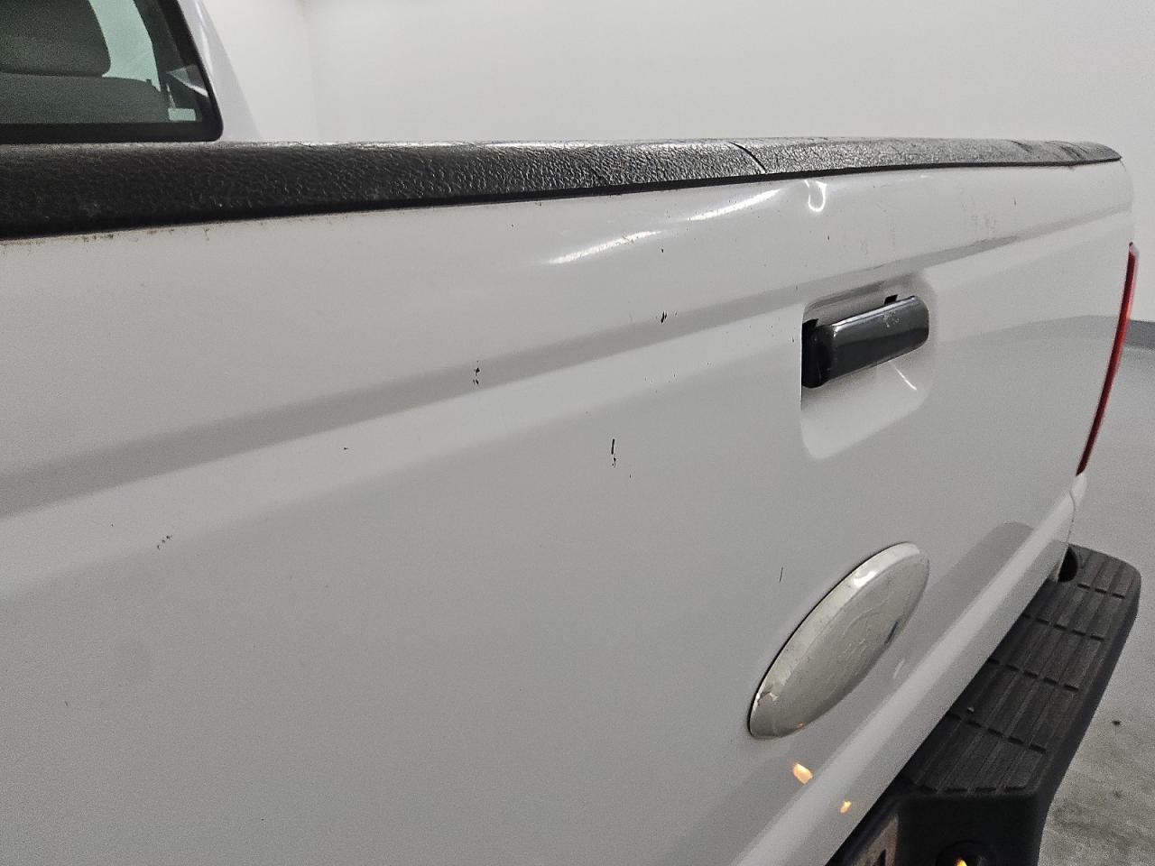 2010 Ford Ranger White vin: 1FTKR1AD0APA21946 Damage: Tailgate, Dent(S) W/ Paint Dmg, 5 To 6 Inches