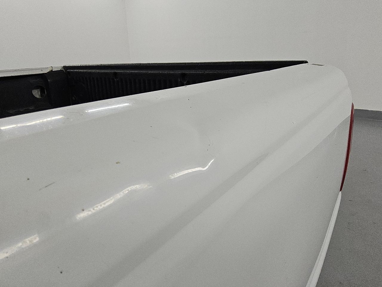 2010 Ford Ranger White vin: 1FTKR1AD0APA21946 Damage: Left Bed Side, Dent(S) W/ Paint Dmg, 7 To 8 Inches