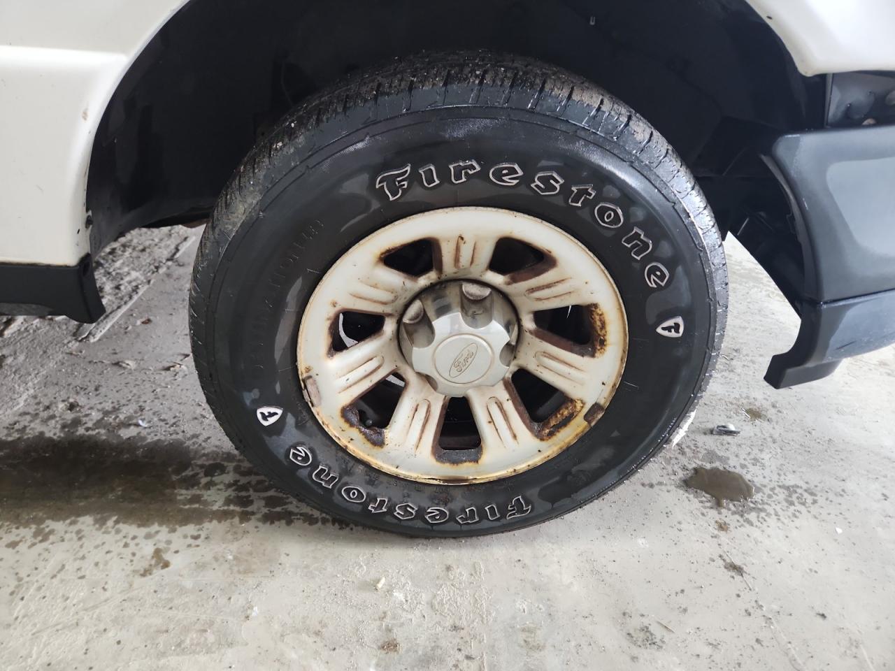 2011 Ford Ranger White vin: 1FTKR1AD0BPB02611 Damage: Right Front Wheel, Corrosion, > 12 Inches