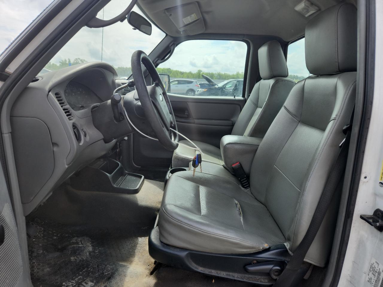 2011 Ford Ranger White vin: 1FTKR1AD0BPB02611 Damage: Steering Wheel, Worn, Replacement Required