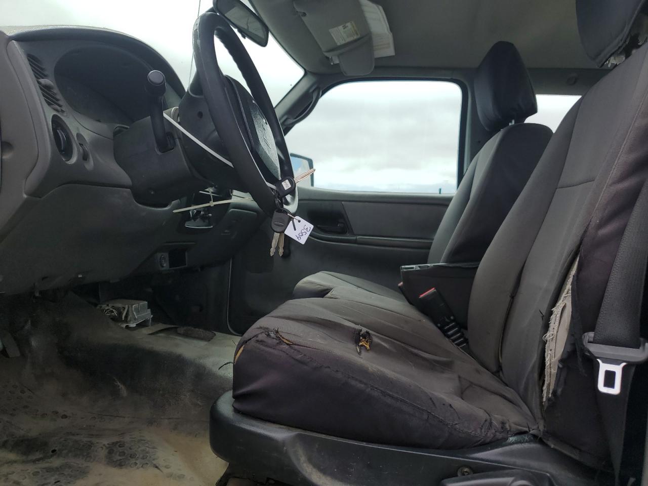 2011 Ford Ranger Super Cab White vin: 1FTKR1EDXBPA62239 Damage: Left Front Seat, Worn, Replacement Required