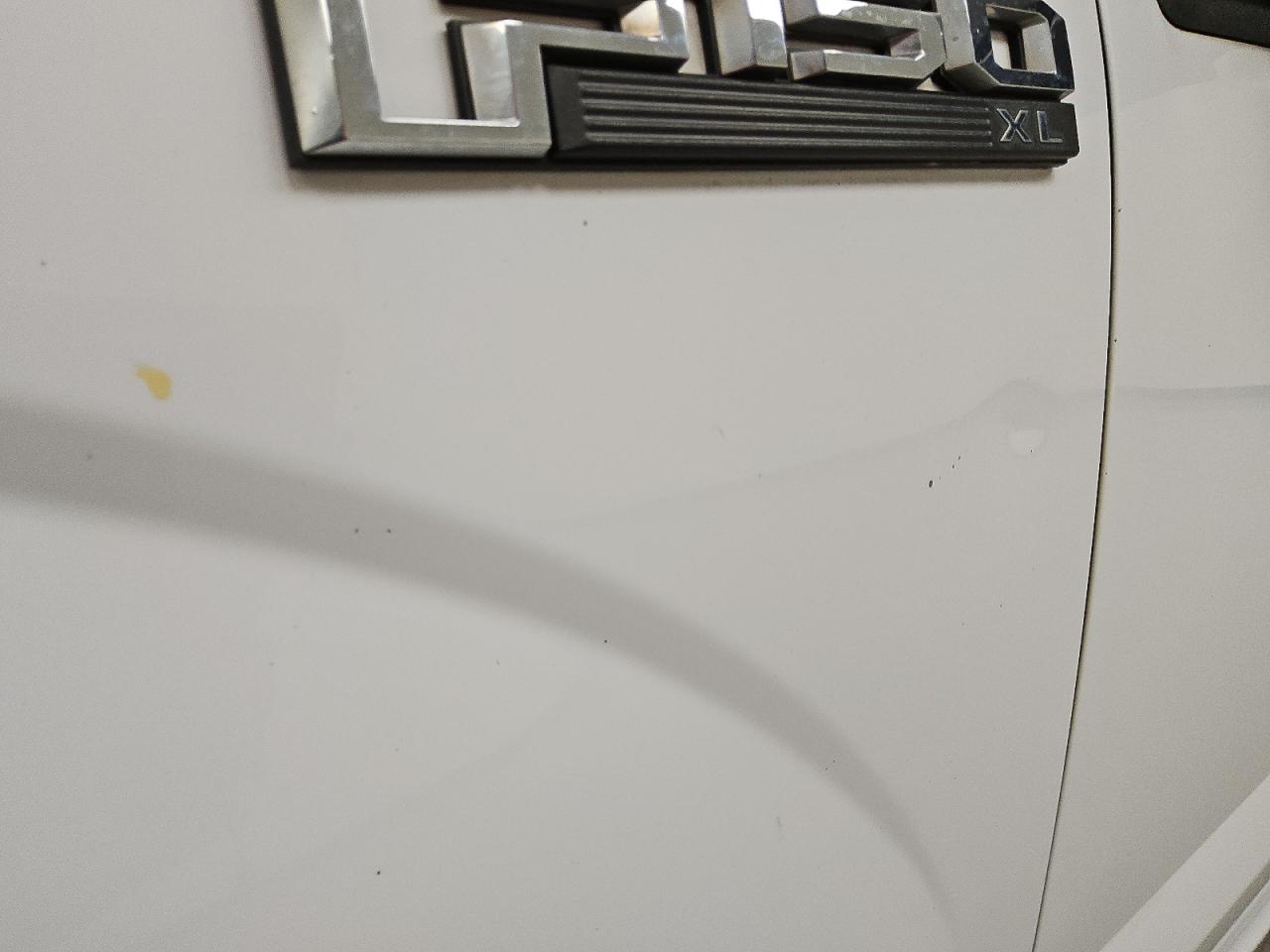 2015 Ford F150 White vin: 1FTMF1C85FKD17440 Damage: Left Front Fender, Dent(S) W/ Paint Dmg, 1/8 To 1/2 Inch