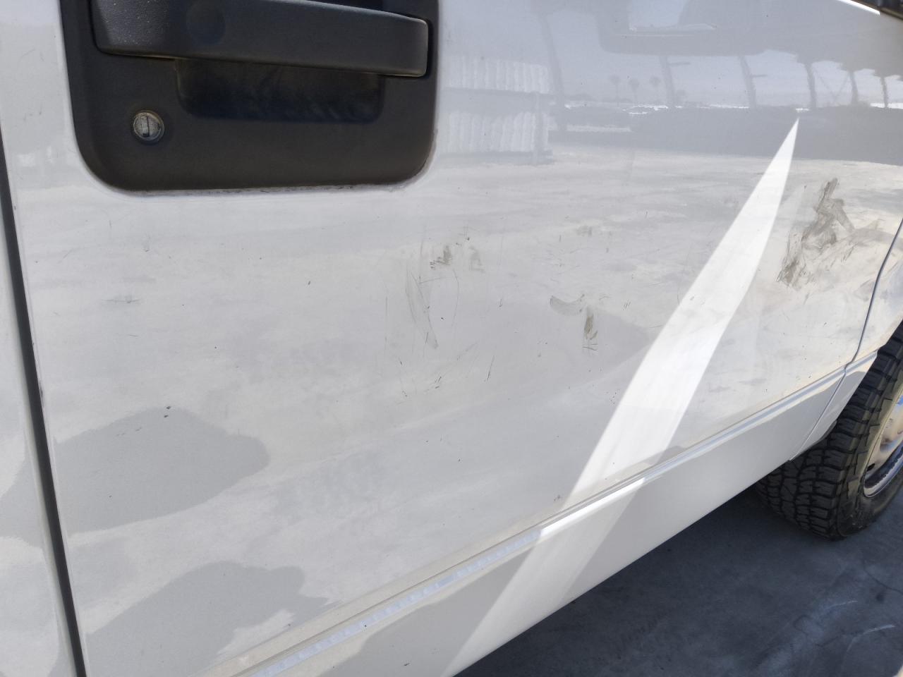 2013 Ford F150 White vin: 1FTMF1CM5DKG35777 Damage: Right Front Door, Dent(S) W/ Paint Dmg, 1/2 To 1 Inch
