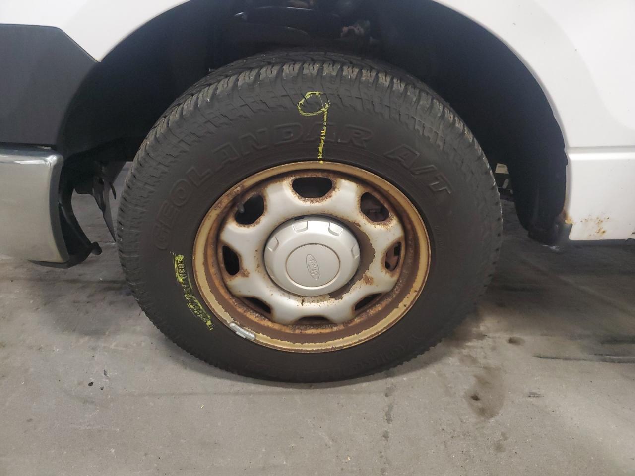 2014 Ford F150 White vin: 1FTMF1CM5EKF54442 Damage: Left Front Wheel, Rust, Repair Required