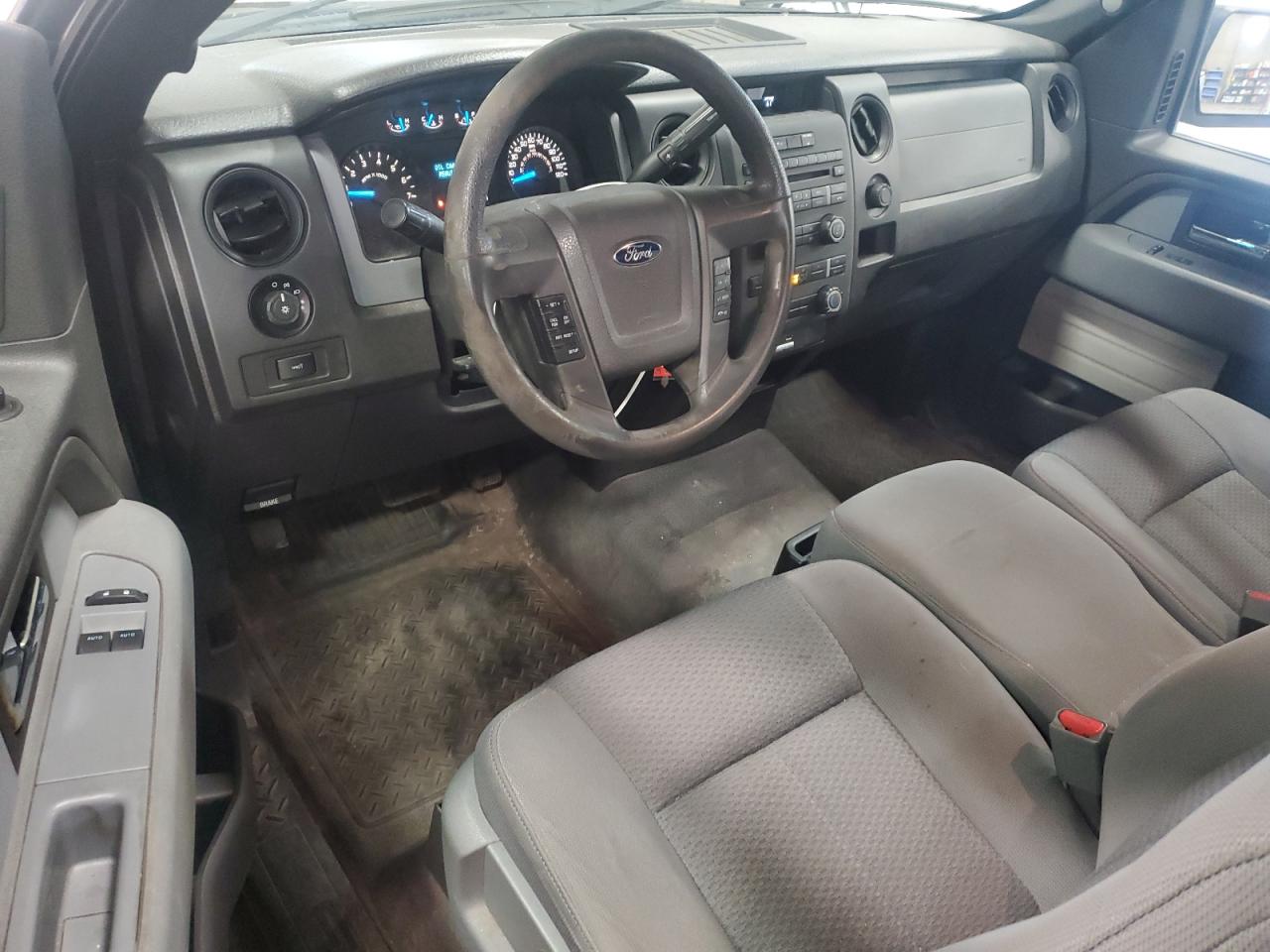 2014 Ford F150 White vin: 1FTMF1CM5EKF54442 Damage: Left Front Carpet, Worn, Replacement Required
