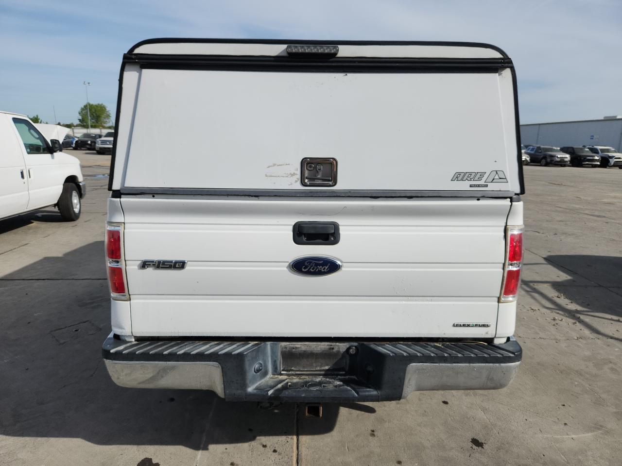 2013 Ford F150 White vin: 1FTMF1CM8DKG52606 Damage: Rear Metal Bumper Chrome, Dent(S) W/No Paint Dmg, 9 To 10 Inches
