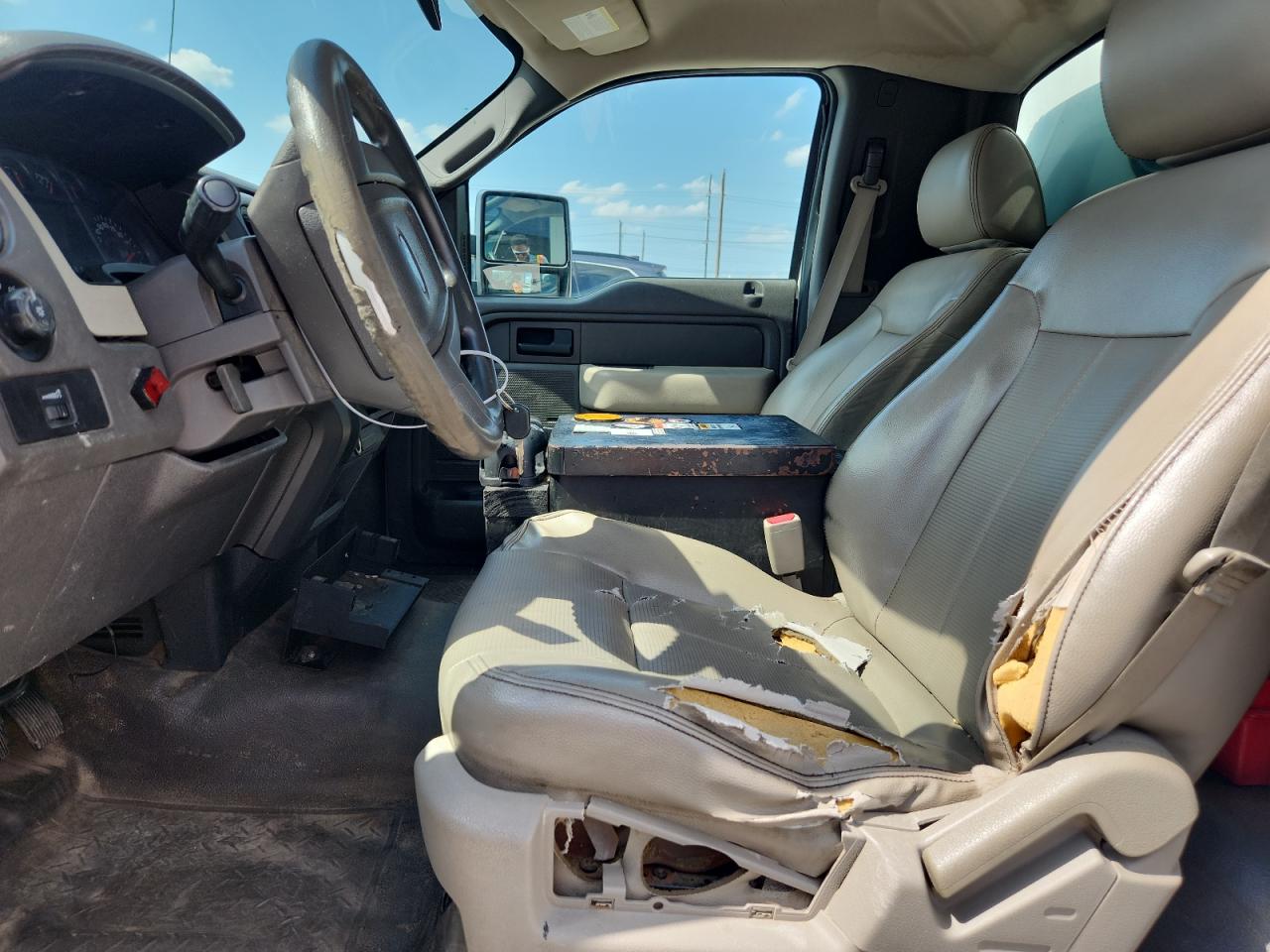 2010 Ford F150 White vin: 1FTMF1CW6AKB11079 Damage: Left Front Seat Cushion, Torn, > 12 Inches
