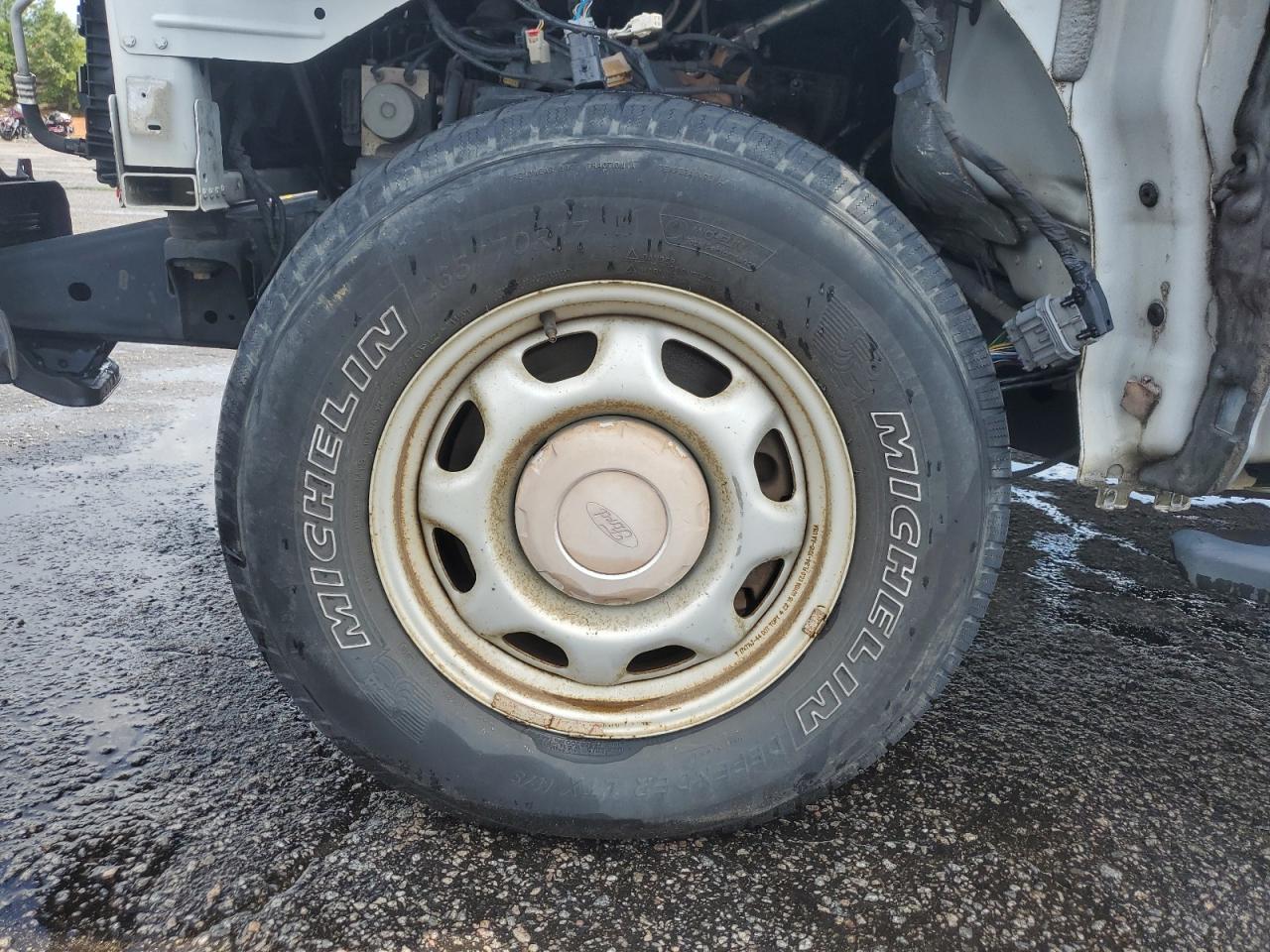 2015 Ford F150 White vin: 1FTMF1E84FFB08213 Damage: Left Front Wheel, Rust, Repair Required