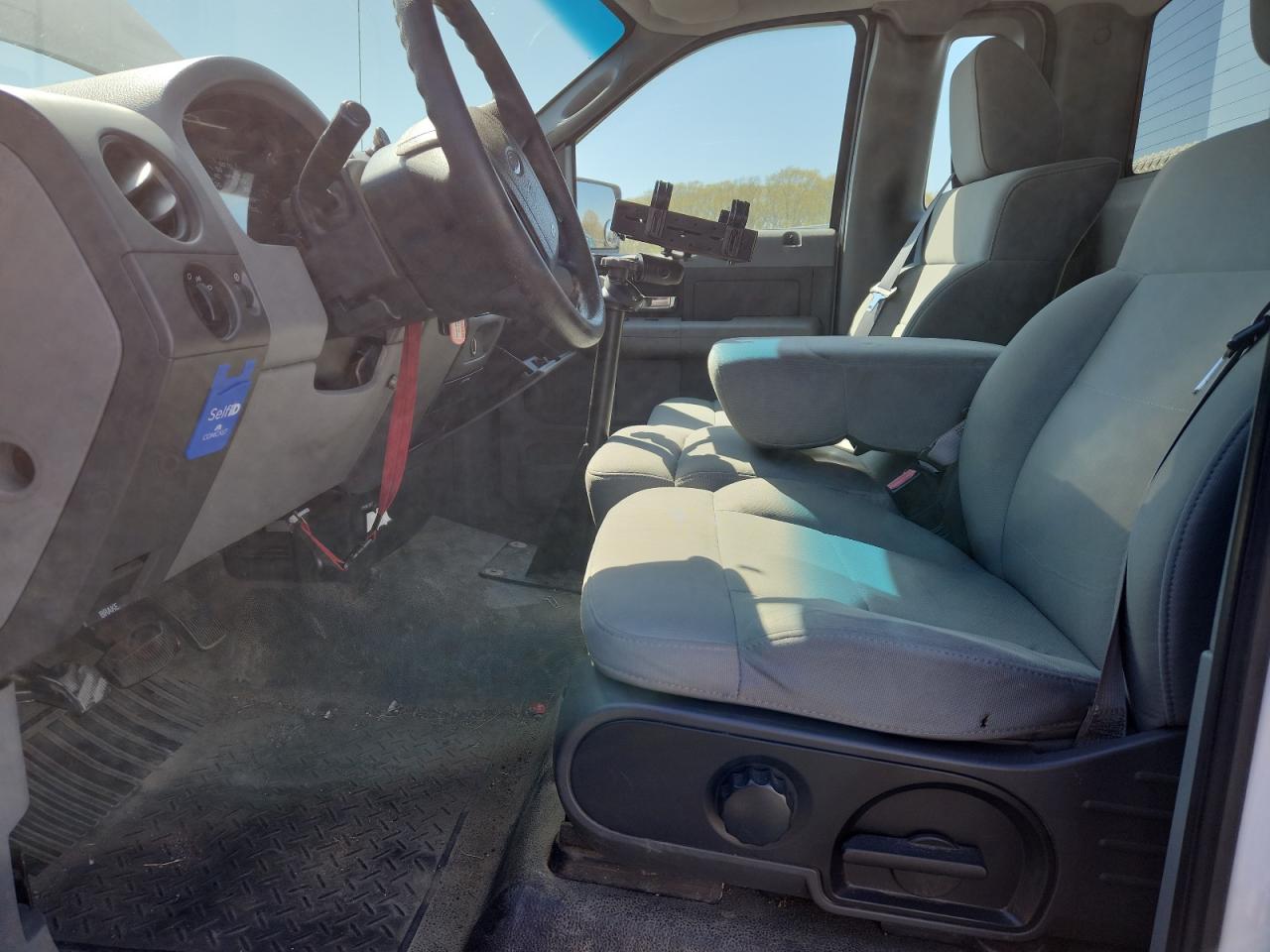2007 Ford F150 White vin: 1FTPF12V47KC40209 Damage: Left Front Seat Cushion, Torn, 1/2 To 1 Inch