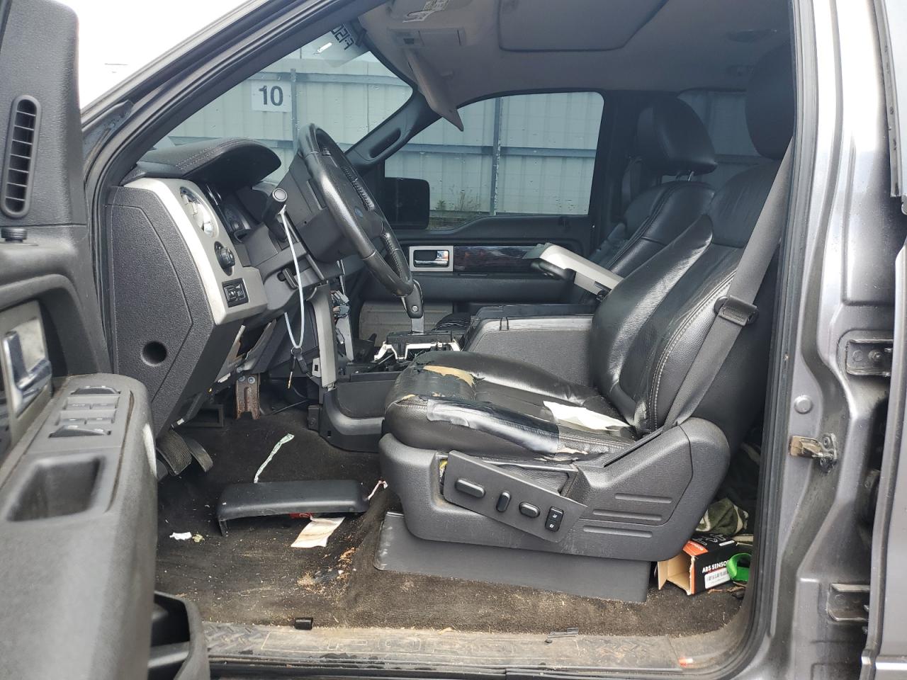 2009 Ford F150 Supercrew Silver vin: 1FTPW14V59FB00212 Damage: Left Front Seat Cushion, Torn, > 12 Inches