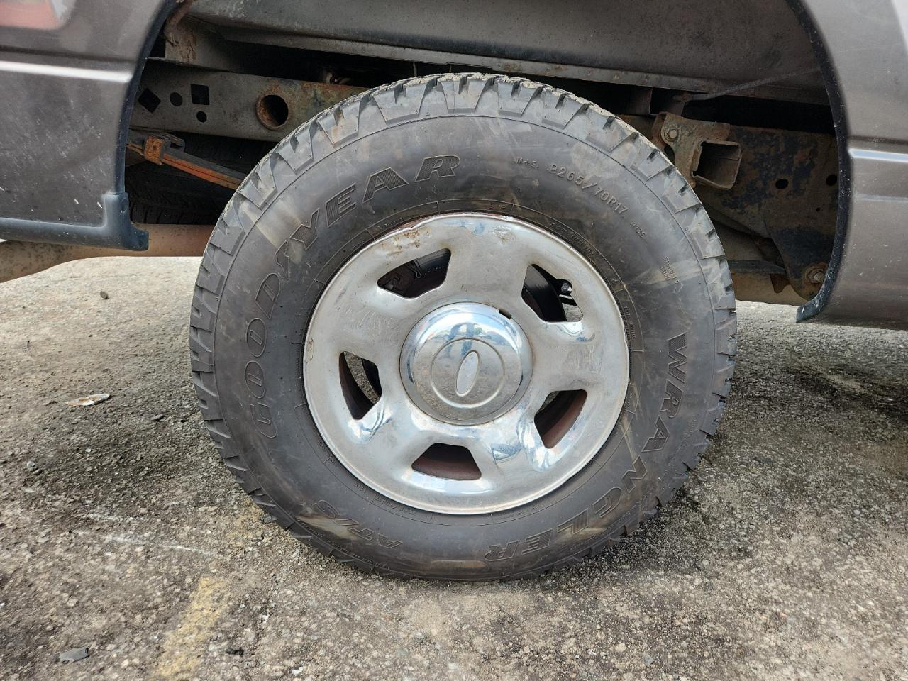 2006 Ford F150 Brown vin: 1FTPX14536FA34509 Damage: Right Rear Wheel, Bent, Replacement Required