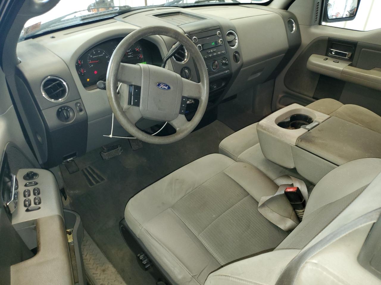 2008 Ford F150 Blue vin: 1FTPX14VX8FA78834 Damage: Front Center Armrest, Stained, Permanent