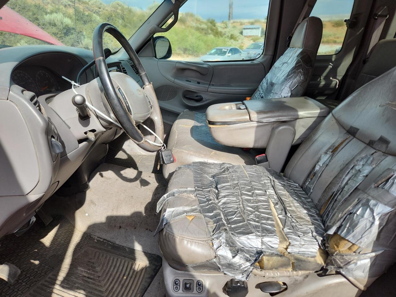 1998 Ford F250 Red vin: 1FTPX28L4WKA85426 Damage: Left Front Seat, Torn, > 12 Inches