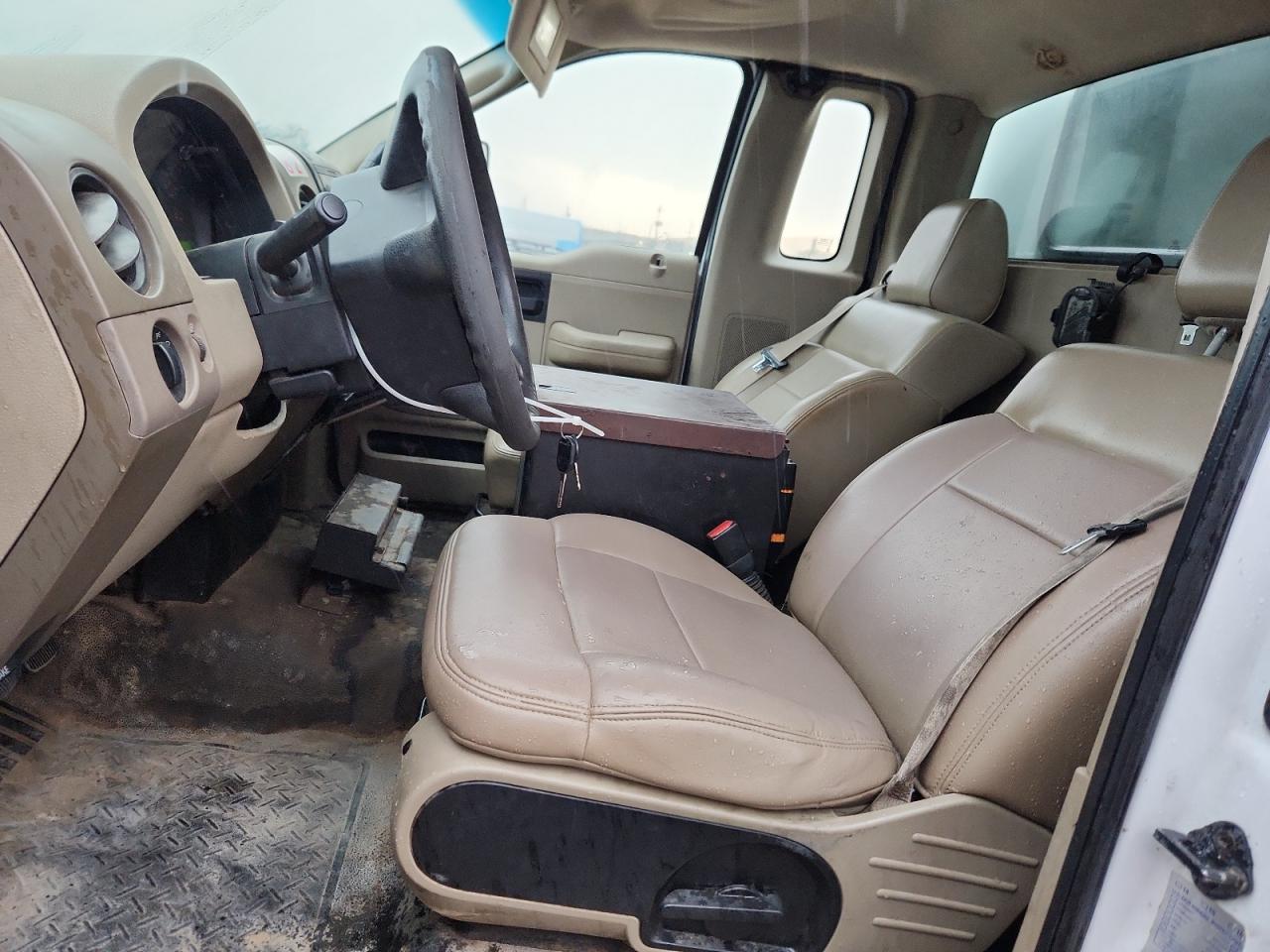 2008 Ford F150 White vin: 1FTRF12208KB70272 Damage: Left Front Seat Cushion, Worn, Acceptable