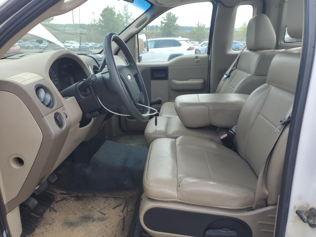 2008 Ford F150 White vin: 1FTRF12238KB62960 Damage: Left Front Seat, Torn, 1 To 2 Inches