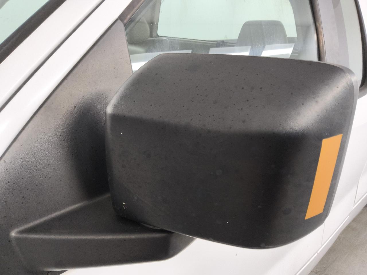 2008 Ford F150 White vin: 1FTRF12248KB70100 Damage: Lf Mirror Cover, Light Scratch, 1/2 To 1 Inch