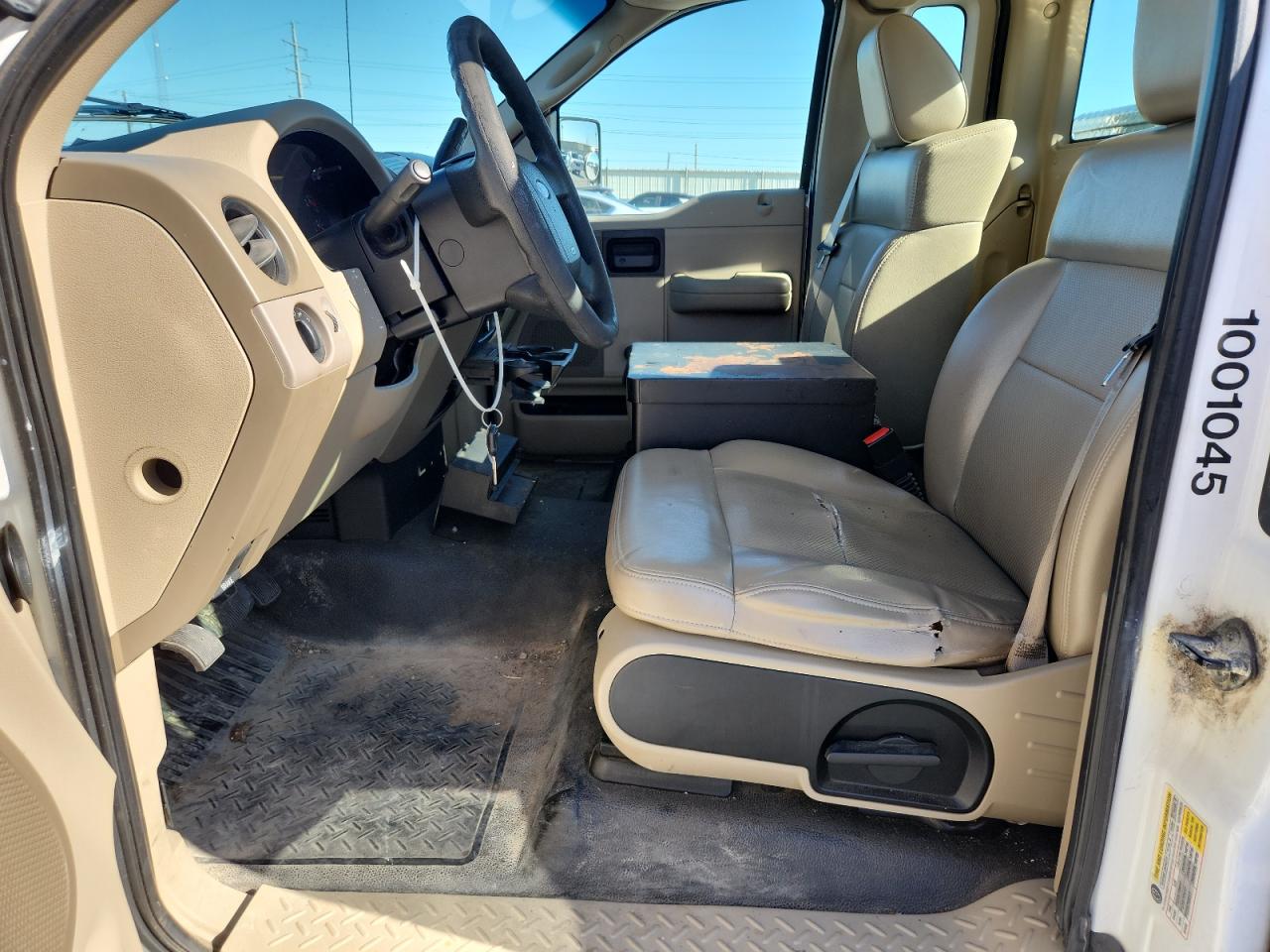 2008 Ford F150 White vin: 1FTRF12258KB87567 Damage: Left Front Seat Cushion, Cut, 8 To 9 Inches