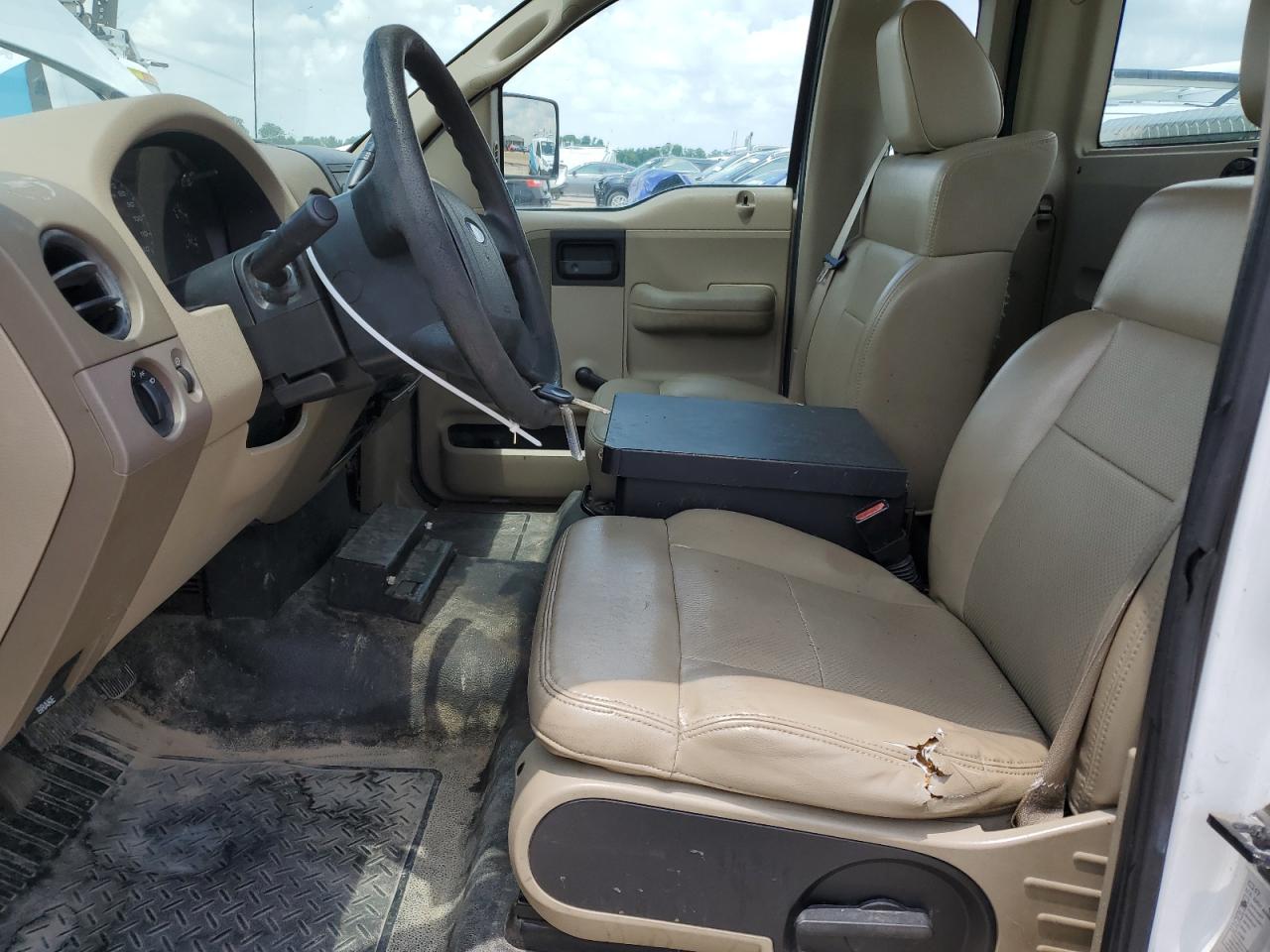 2008 Ford F150 White vin: 1FTRF12W48KB87918 Damage: Left Front Seat, Torn, 1 To 2 Inches