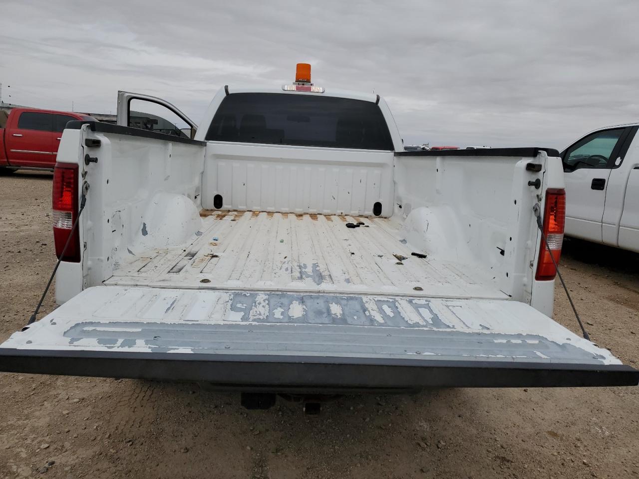 2008 Ford F150 White vin: 1FTRF12W78KB87900 Damage: Inside Bed, Peeling, > 12 Inches