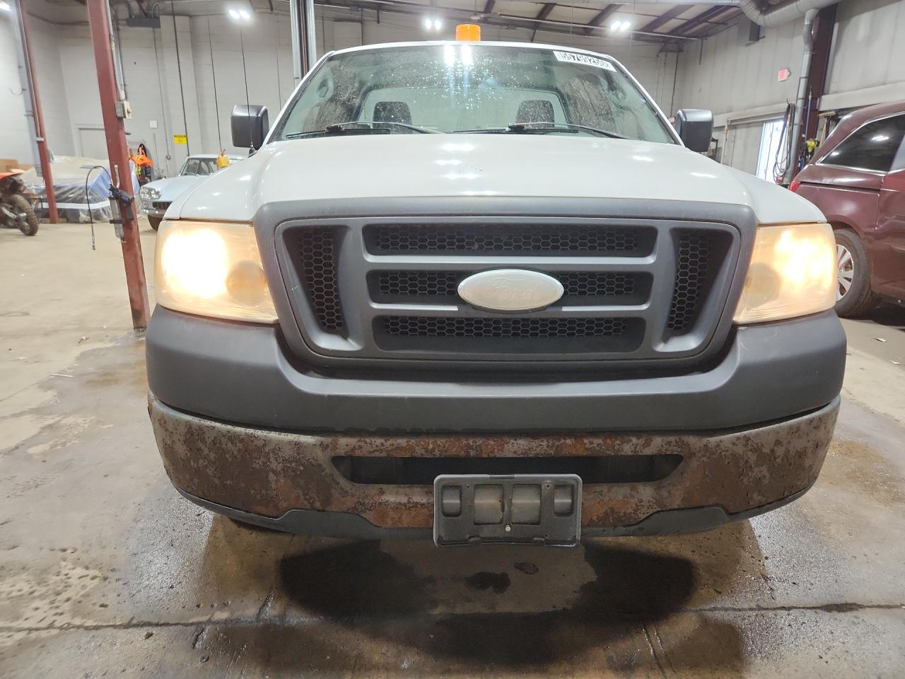 2006 Ford F150 White vin: 1FTRF12W86KD44363 Damage: Front Metal Bumper Painted, Rust, > 12 Inches
