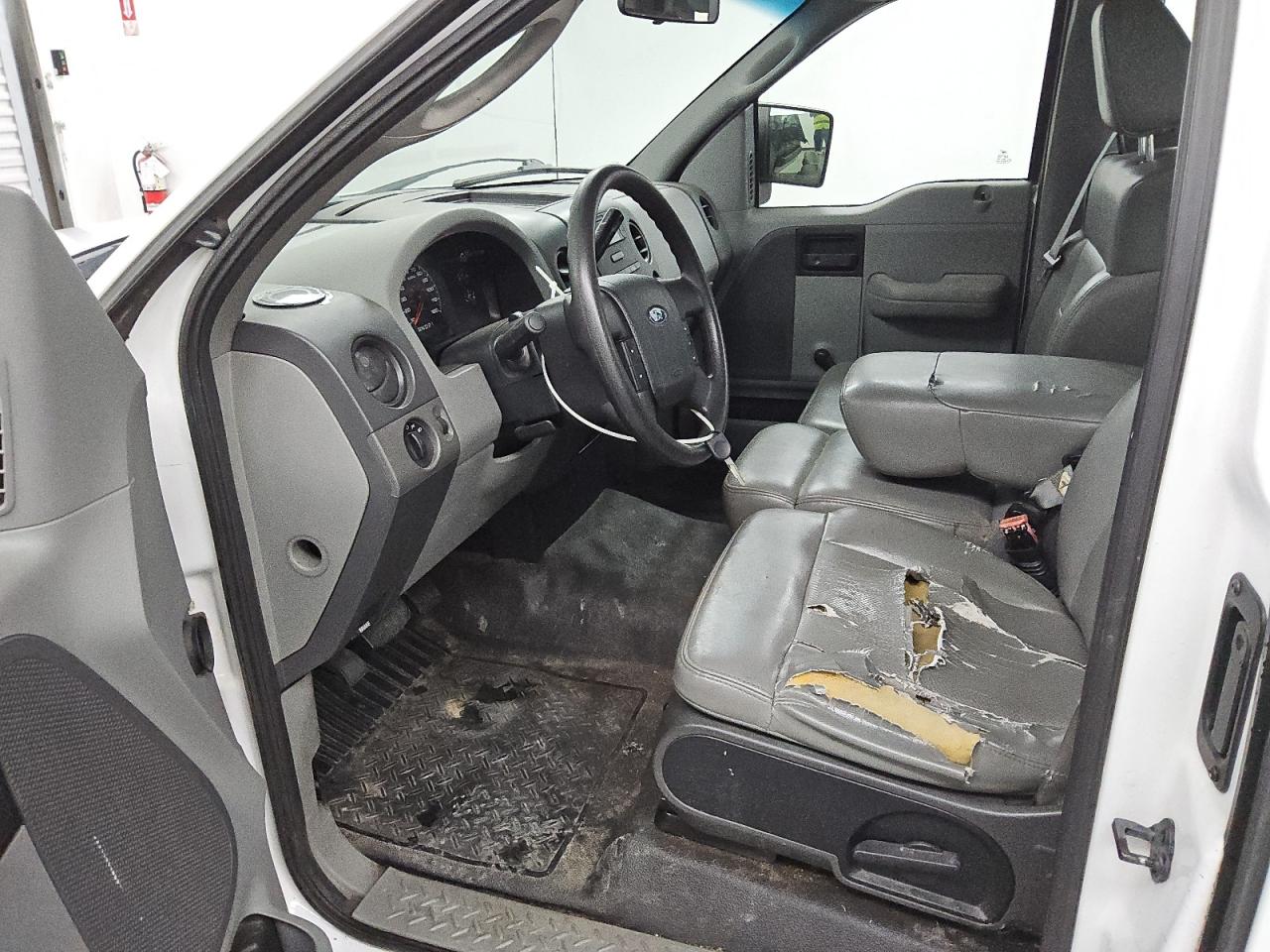 2008 Ford F150 White vin: 1FTRF12W88KE22756 Damage: Front Center Armrest, Cut, 4 To 5 Inches