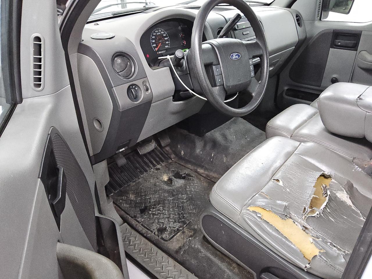 2008 Ford F150 White vin: 1FTRF12W88KE22756 Damage: Left Front Seat Cushion, Torn, > 12 Inches