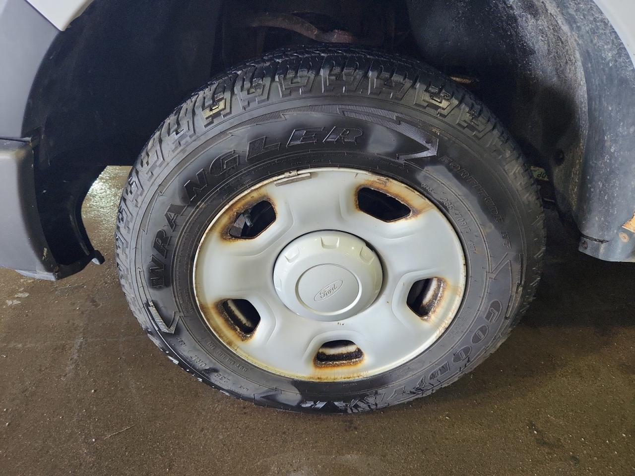 2009 Ford F150 White vin: 1FTRF12W89KA23802 Damage: Left Front Wheel, Rust, Repair Required