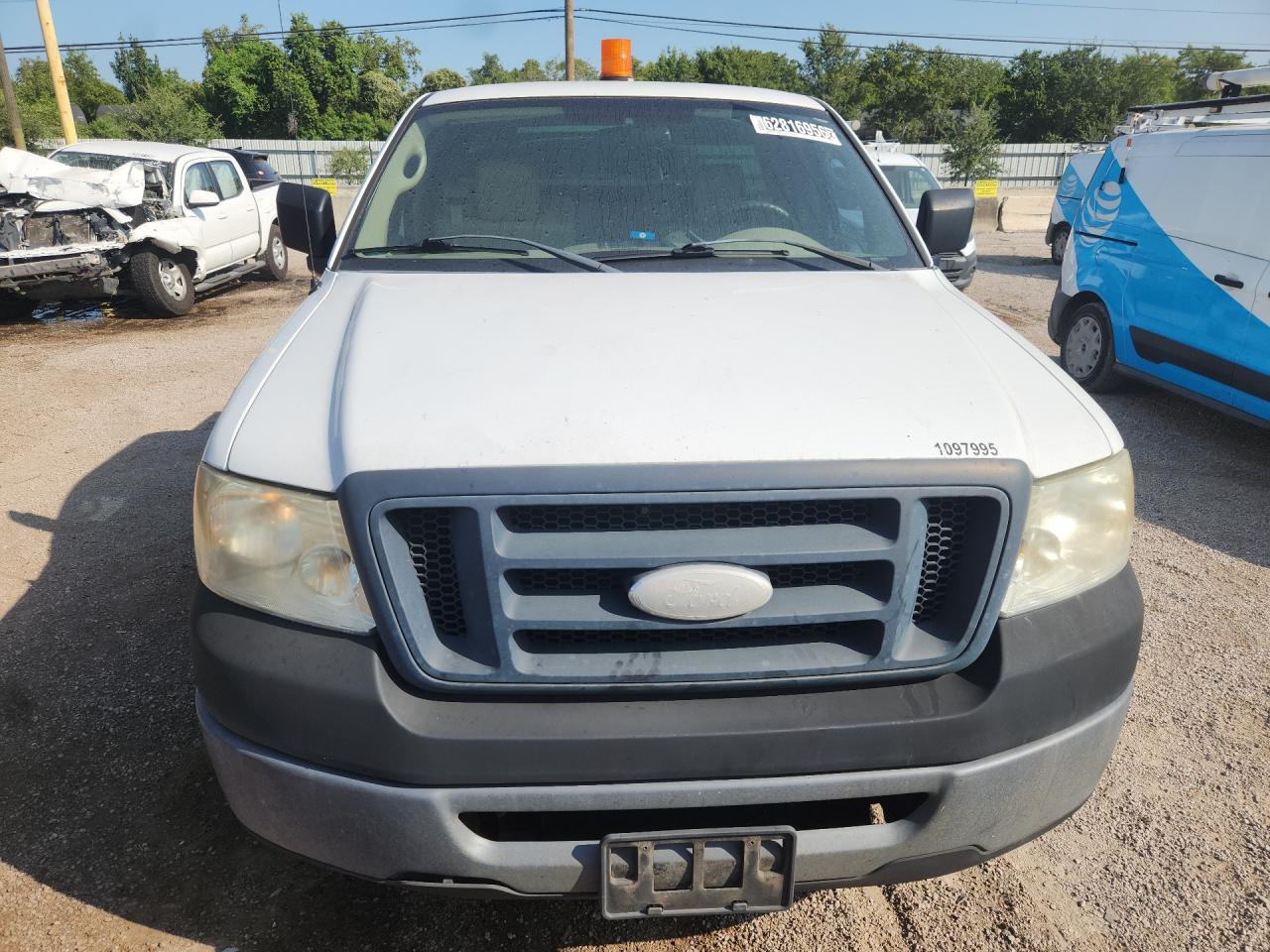 2007 Ford F150 White vin: 1FTRF12WX7KC18135 Damage: Front Bumper Molding, Broken, Replacement Required