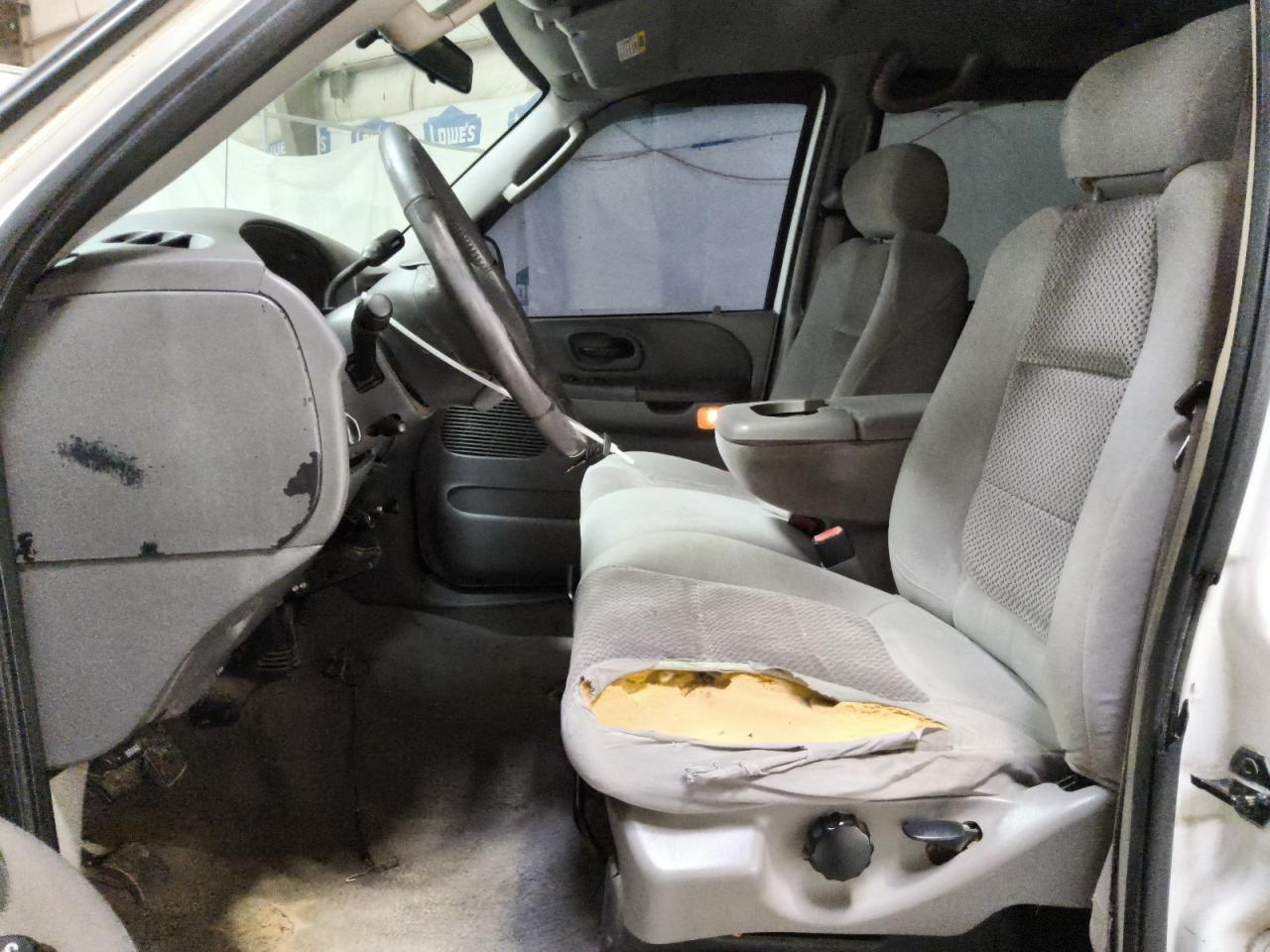 2003 Ford F150 Supercrew White vin: 1FTRW07653KA13657 Damage: Left Front Seat, Worn, Replacement Required