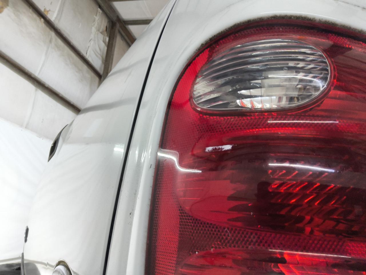 2003 Ford F150 Supercrew White vin: 1FTRW07653KA13657 Damage: Left Tail Light, Cracked, Replacement Required