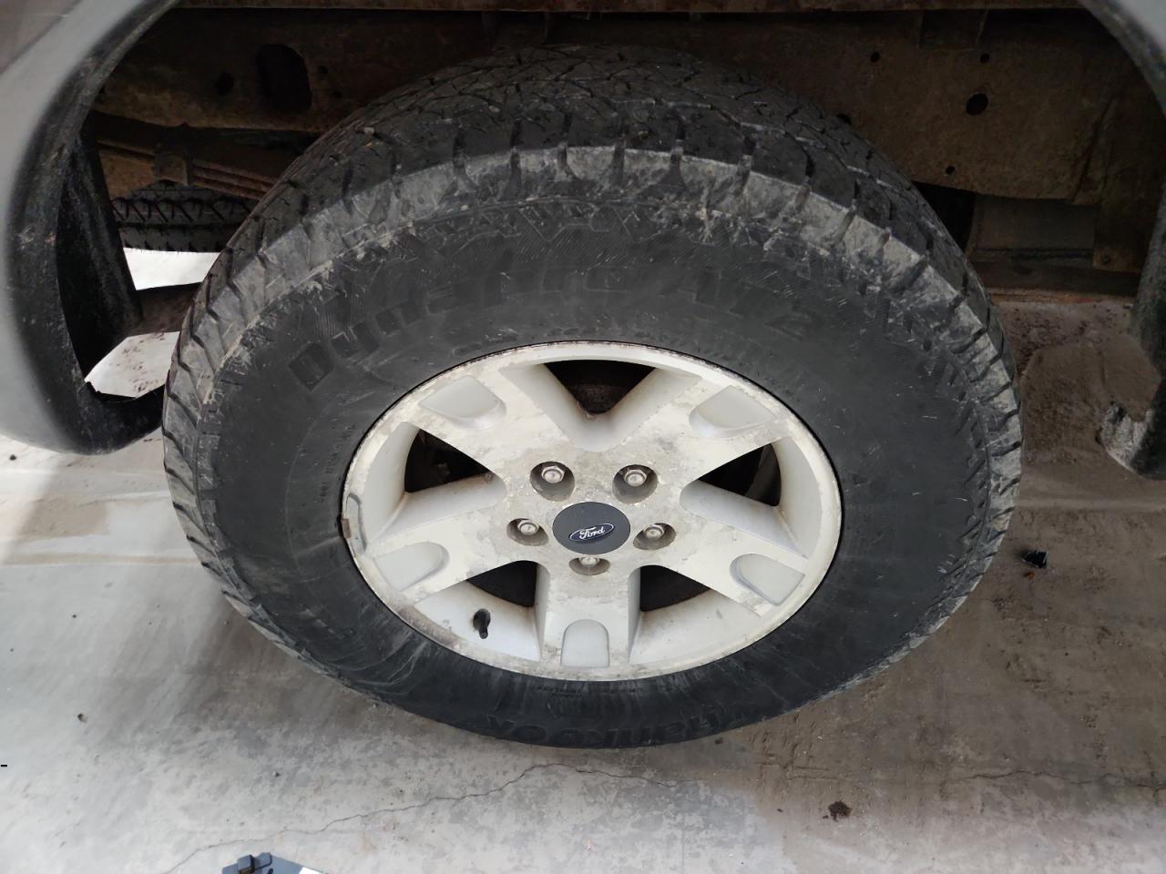 2003 Ford F150 Supercrew Black vin: 1FTRW08L33KC56226 Damage: Right Rear Wheel, Corrosion, > 12 Inches