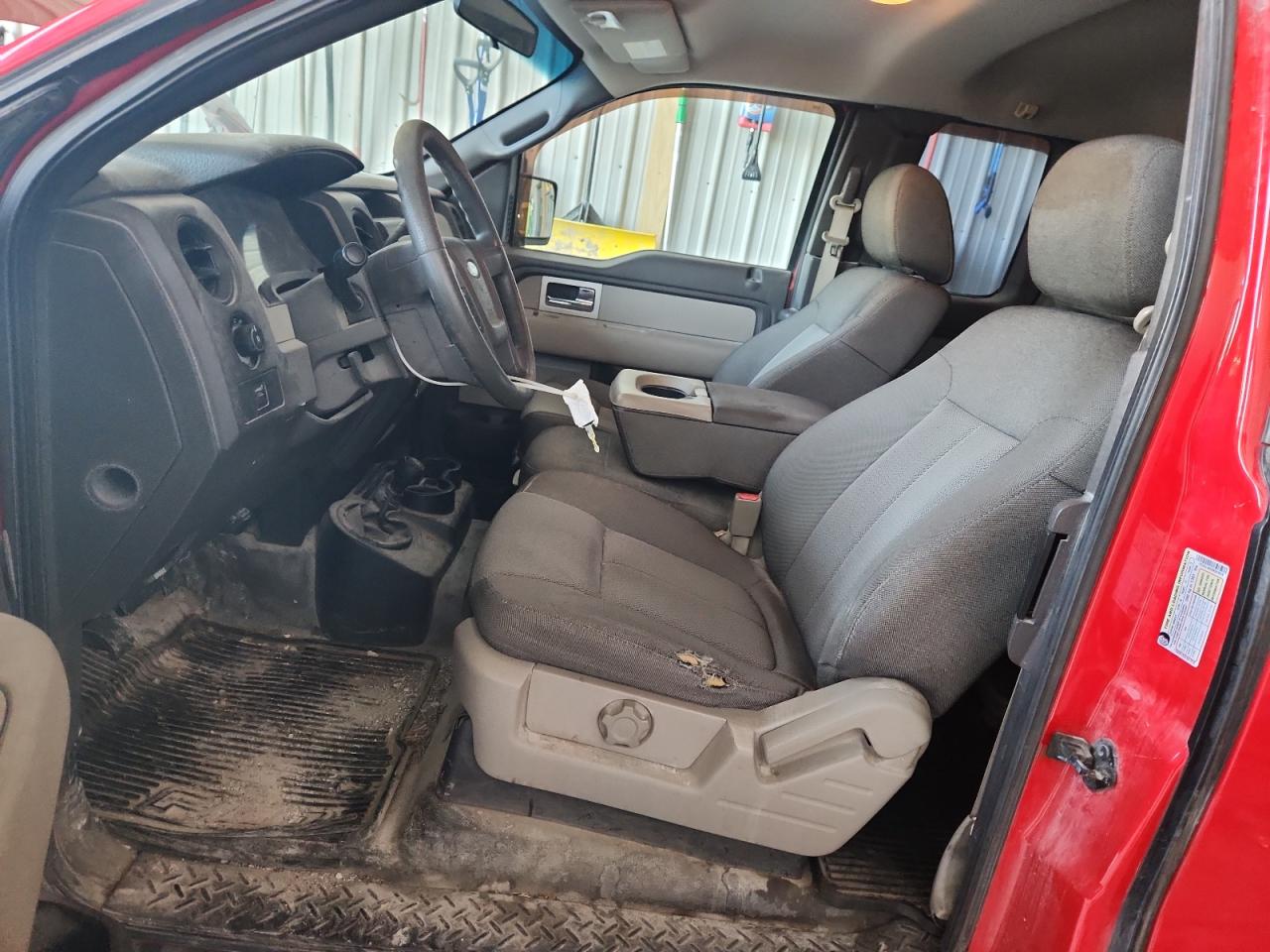 2009 Ford F150 Super Cab Red vin: 1FTRX14W59KB43678 Damage: Left Front Seat Cushion, Worn, Replacement Required