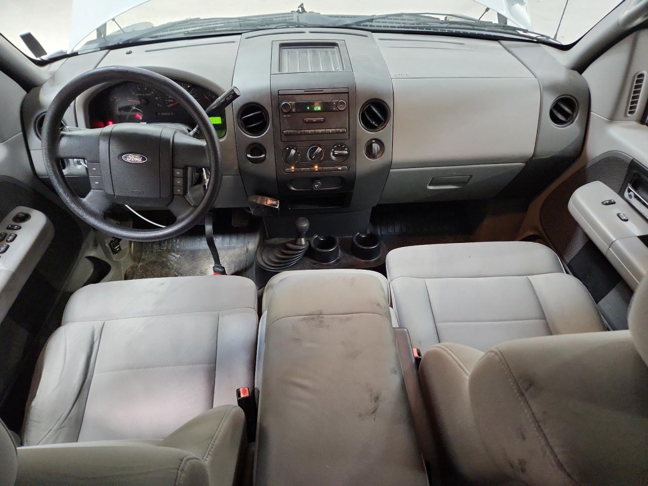 2008 Ford F150 White vin: 1FTRX14W68KC89294 Damage: Front Center Armrest, Stained, Permanent